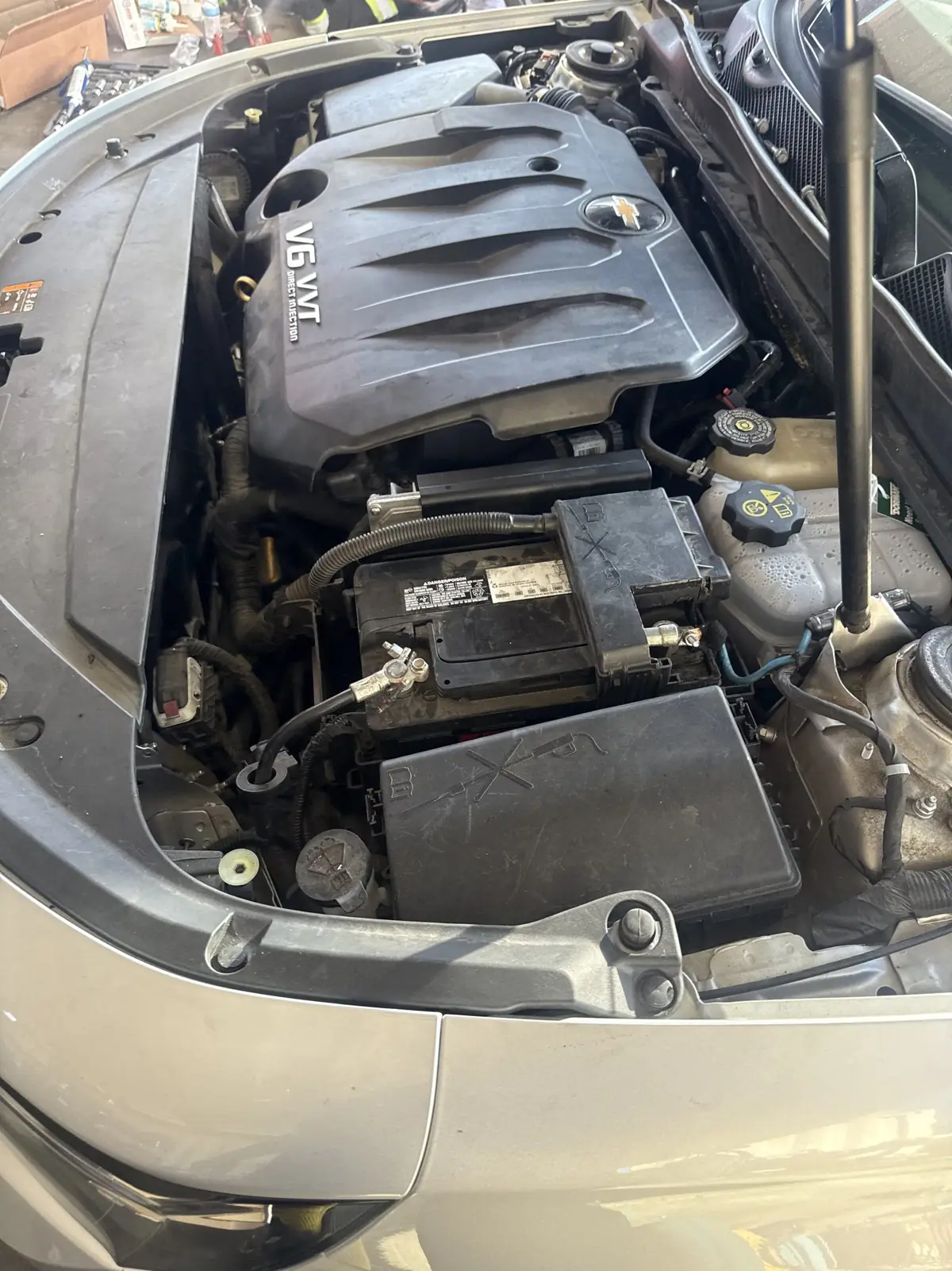 V6 bay with the battery and fuse box in view.