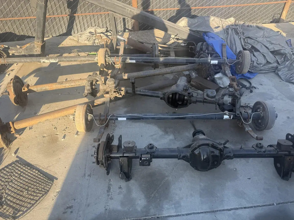 Two rear axle assemblies pulled and laid out.