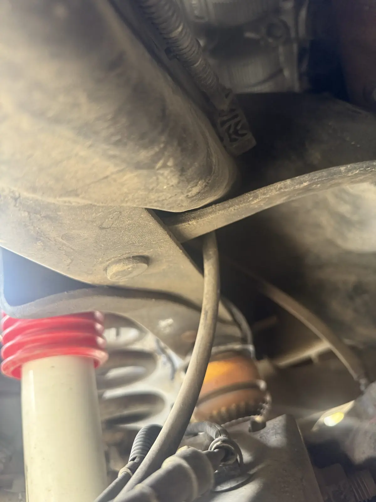 Coil spring, sway bar link and boot on a front corner.