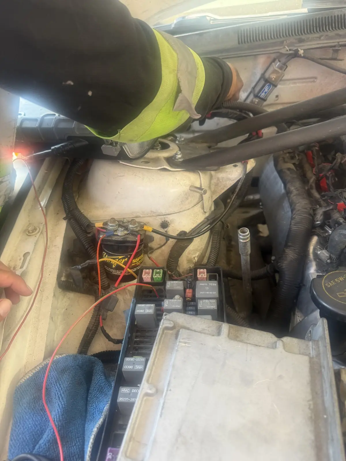 Back probing a circuit under a work light.