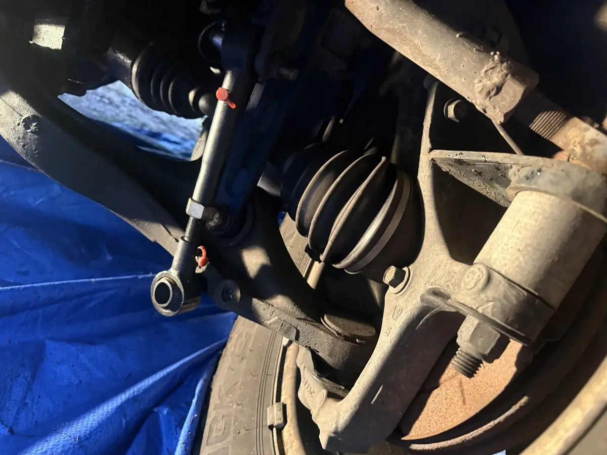 Separating a tie rod end with a puller.